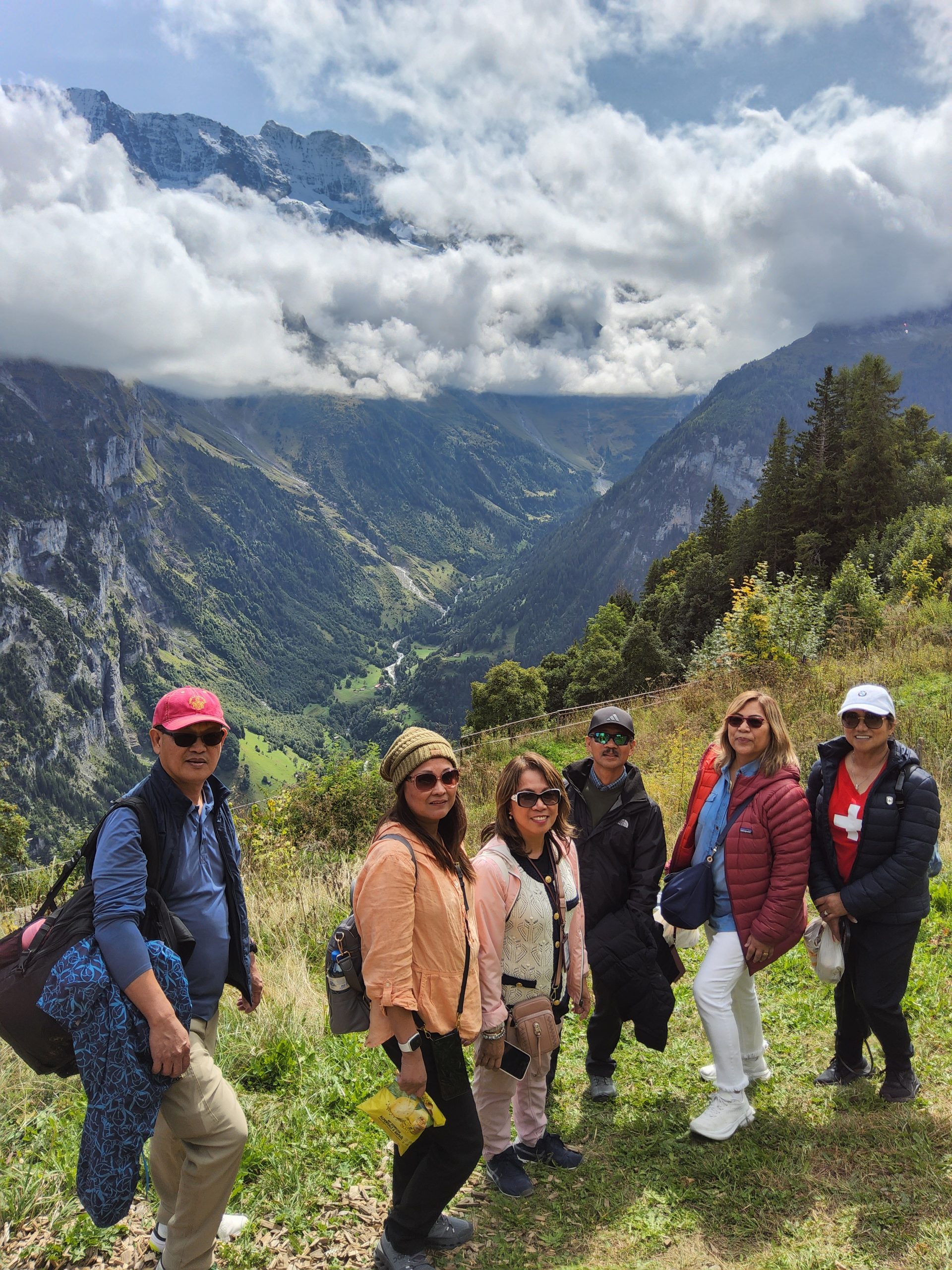 Panoramic view of Mürren village with Staubbach Fall visible across the Lauterbrunnen Valley